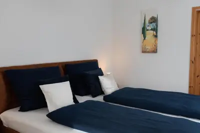 Ein Bett oder Betten in einem Zimmer der Unterkunft Ferienwohnung am Kurpark Ostrau