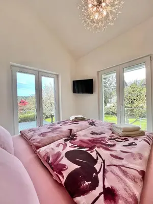 Ein Bett oder Betten in einem Zimmer der Unterkunft Ferienhaus „Am Sandstein“