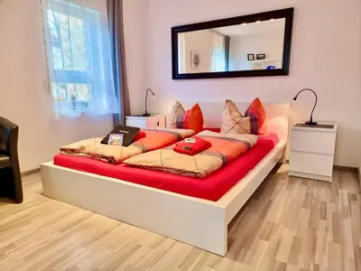 Ein Bett oder Betten in einem Zimmer der Unterkunft FeWo 2,4,5,6 Altstadt - Am grossen Garten