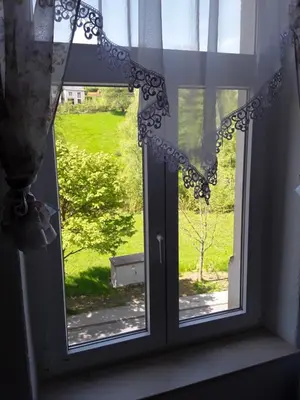 Ein Garten an der Unterkunft Ferienwohnung Rote-Villa 2