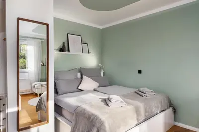 Ein Bett oder Betten in einem Zimmer der Unterkunft EDLER WOHNRAUM Luxuriöse Stadtoase mit Balkon, Kaffeevollautomat, Lift & Parkplatz