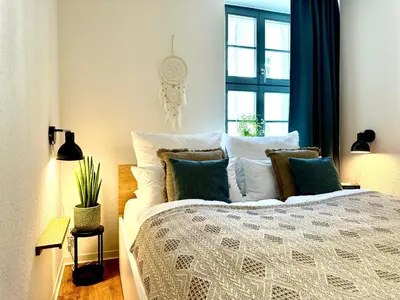 Ein Bett oder Betten in einem Zimmer der Unterkunft Im Herzen der Stadt - mit kostenlosem Parkplatz