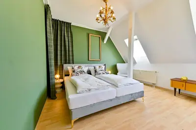 Ein Bett oder Betten in einem Zimmer der Unterkunft Apartments Chemnitz