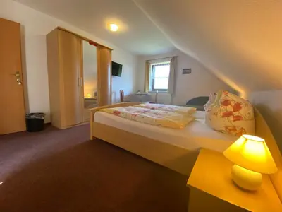 Ein Bett oder Betten in einem Zimmer der Unterkunft Ferienpension Gabriele