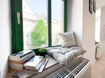 Ein Sitzbereich in der Unterkunft Zentrales Apartment mit TV, Küche und Mikrowelle