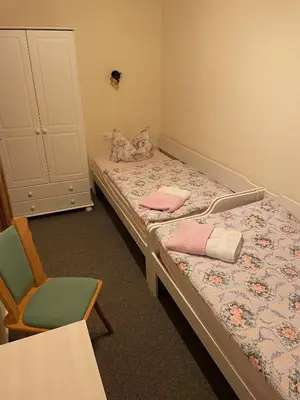 Ein Bett oder Betten in einem Zimmer der Unterkunft Gasthof Hertigswalde