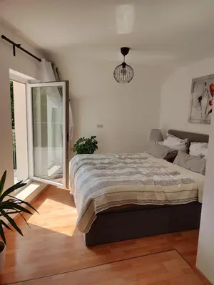Ein Bett oder Betten in einem Zimmer der Unterkunft Ferienwohnung zur alten Post