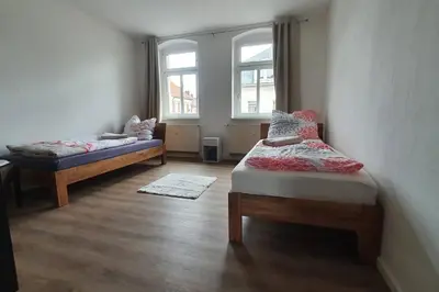 Ein Bett oder Betten in einem Zimmer der Unterkunft Monteurswohnung Roßwein - Zentral - Küche
