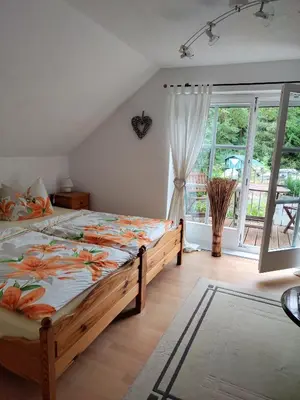 Ein Bett oder Betten in einem Zimmer der Unterkunft Gästezimmer am Malerweg