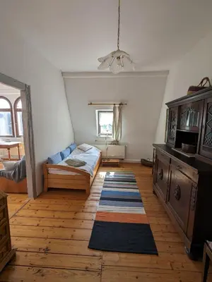 Ein Bett oder Betten in einem Zimmer der Unterkunft Apartment-Mansardwohnung