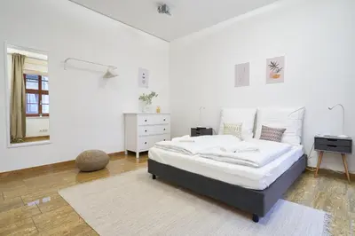 Ein Bett oder Betten in einem Zimmer der Unterkunft Global Living - Design Apartments I City Center I Balcony I Smart-TV I Kitchen I Dresden