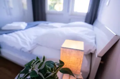 Ein Bett oder Betten in einem Zimmer der Unterkunft Design Apartment - Balkon - Induktionskochfeld - Zentral