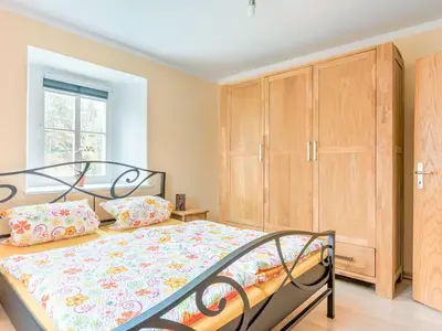 Ein Bett oder Betten in einem Zimmer der Unterkunft Malerischer Aufenthalt in Rauschenbach