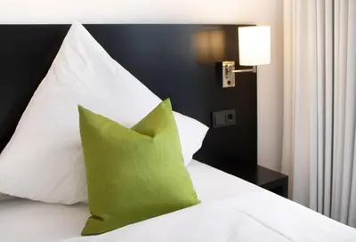 Ein Bett oder Betten in einem Zimmer der Unterkunft OSL Hotel by WMM Hotels