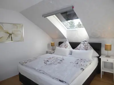 Ein Bett oder Betten in einem Zimmer der Unterkunft Ferienhaus zwischen den Seen