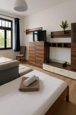 Ein Bett oder Betten in einem Zimmer der Unterkunft TOP ANGEBOT - große Wohnung - max 6 Personen - WiFi - Waschmaschine - Badewanne - 2 Parkplätze - zentrale Lage - große Küche TOP