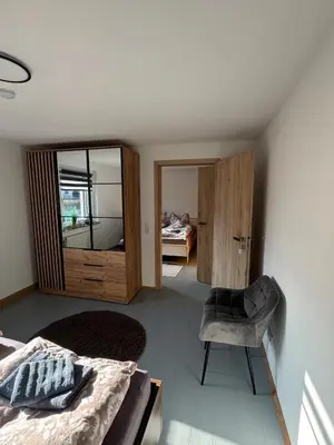 Ein Bett oder Betten in einem Zimmer der Unterkunft Familien-Ferienhaus am Felsenlabyrinth