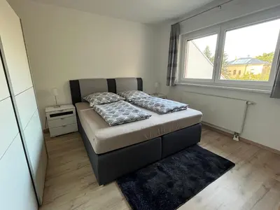 Ein Bett oder Betten in einem Zimmer der Unterkunft NP-Apartments Blasewitz