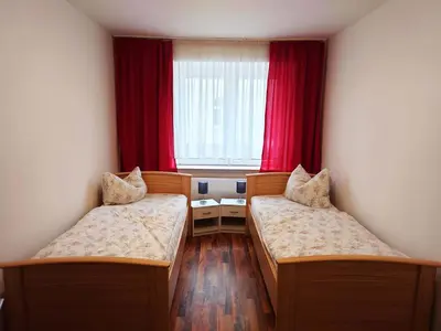 Ein Bett oder Betten in einem Zimmer der Unterkunft Ruhige Monteurwohnung Freiberg