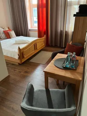 Ein Bett oder Betten in einem Zimmer der Unterkunft Pension Kulturhaus Niederau