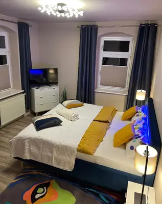 Ein Bett oder Betten in einem Zimmer der Unterkunft Pension Kulturhaus Niederau