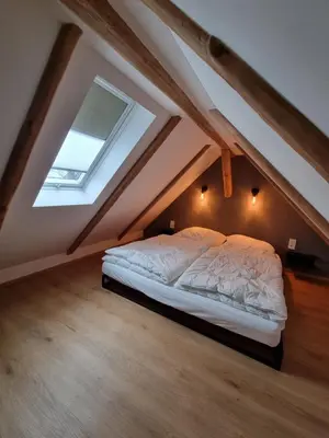 Ein Bett oder Betten in einem Zimmer der Unterkunft Ferienhaus-DP8