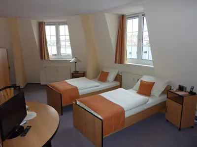 Ein Bett oder Betten in einem Zimmer der Unterkunft Pension an der Weisseritz