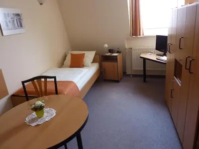 Ein Bett oder Betten in einem Zimmer der Unterkunft Pension an der Weisseritz