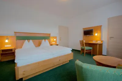 Ein Bett oder Betten in einem Zimmer der Unterkunft Pension Am Finkenberg