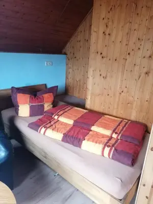 Ein Bett oder Betten in einem Zimmer der Unterkunft Weidmannsruh Apartment für 2 bis 3 Personen