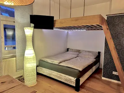 Ein Bett oder Betten in einem Zimmer der Unterkunft Ferienwohnung STENJA