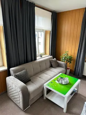 Ein Sitzbereich in der Unterkunft Pension Zur Wartburg