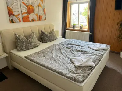 Ein Bett oder Betten in einem Zimmer der Unterkunft Pension Zur Wartburg