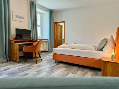 Ein Bett oder Betten in einem Zimmer der Unterkunft Kavaliershaus neben Schloss Rauenstein