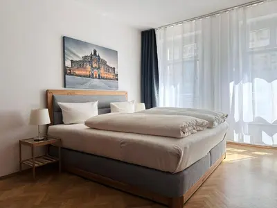 Ein Bett oder Betten in einem Zimmer der Unterkunft Familienapartment Münzgasse mit Blick zur Frauenkirche