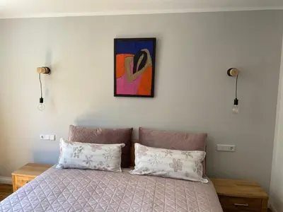 Ein Bett oder Betten in einem Zimmer der Unterkunft Ferienwohnungen im Gästehaus der Villa Wilisch