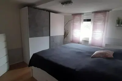Ein Bett oder Betten in einem Zimmer der Unterkunft DG-Ferienwohnung