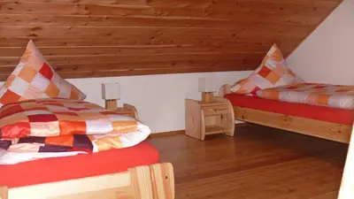 Ein Bett oder Betten in einem Zimmer der Unterkunft Ferienhaus am Sonnenhang