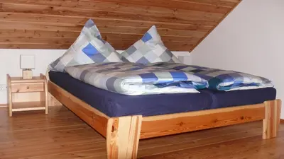 Ein Bett oder Betten in einem Zimmer der Unterkunft Ferienhaus am Sonnenhang