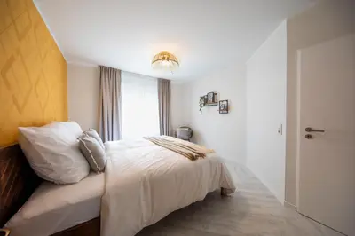 Ein Bett oder Betten in einem Zimmer der Unterkunft Innenstadt-Apartments Klinik Friedrichstadt