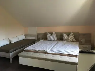Ein Bett oder Betten in einem Zimmer der Unterkunft Landhaus Böhmer, Ferienhaus Schrammsteinblick