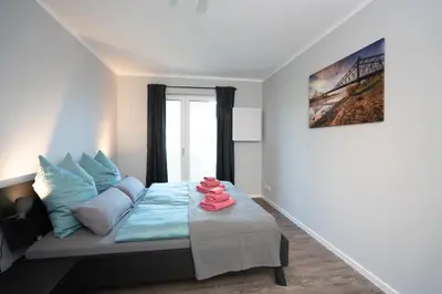 Ein Bett oder Betten in einem Zimmer der Unterkunft Supreme City Dream mit Terrasse und Parkplatz - 110m²