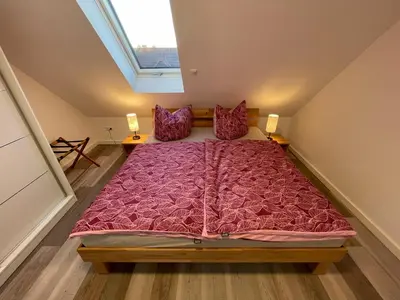 Ein Bett oder Betten in einem Zimmer der Unterkunft Ferienhaus Helfert Fewo DG mit Terrasse