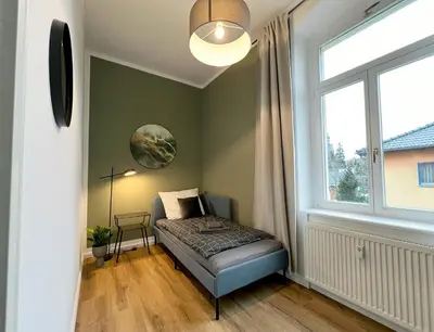 Ein Bett oder Betten in einem Zimmer der Unterkunft Wohnung in Radebeul