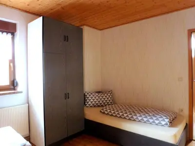 Ein Bett oder Betten in einem Zimmer der Unterkunft Ferienwohnung am Lehnberg, Familie Richter