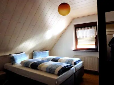 Ein Bett oder Betten in einem Zimmer der Unterkunft Ferienwohnung am Lehnberg, Familie Richter