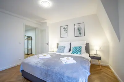 Ein Bett oder Betten in einem Zimmer der Unterkunft CoView - Design Apartment - 2 Schlafzimmer - Küche - Highspeed Wlan