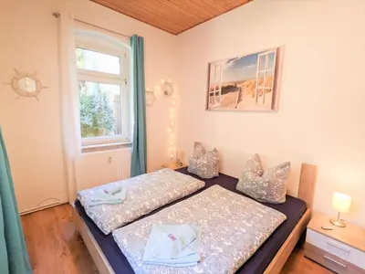 Ein Bett oder Betten in einem Zimmer der Unterkunft R1 - Urlaubsmagie - Bad Schandau fußläufig, Garten