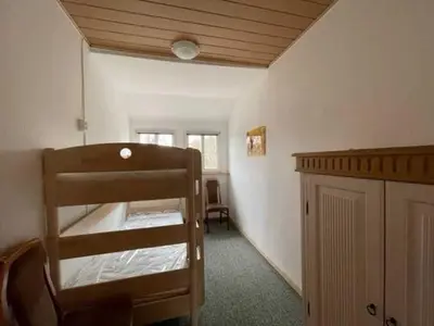 Ein Bett oder Betten in einem Zimmer der Unterkunft Ferienwohnung 