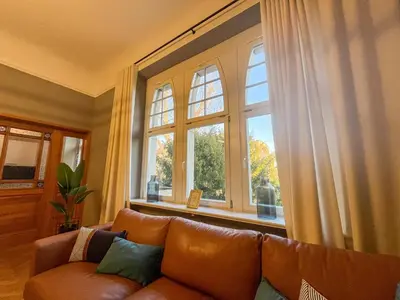 Ein Sitzbereich in der Unterkunft Wohnperle*GroßerGarten*Villa